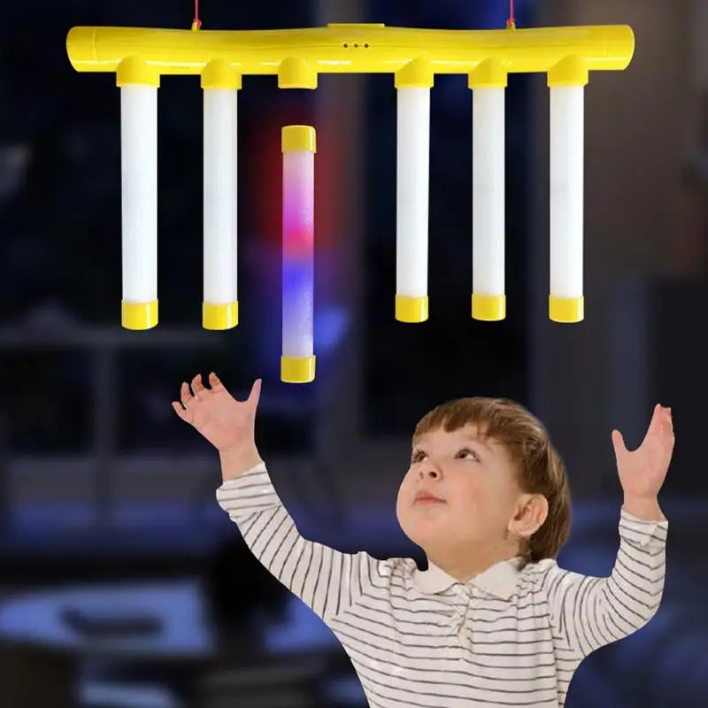 You’ll electrify game night with the Reflex Challenge Glow In The Dark Falling Sticks Catch Game.