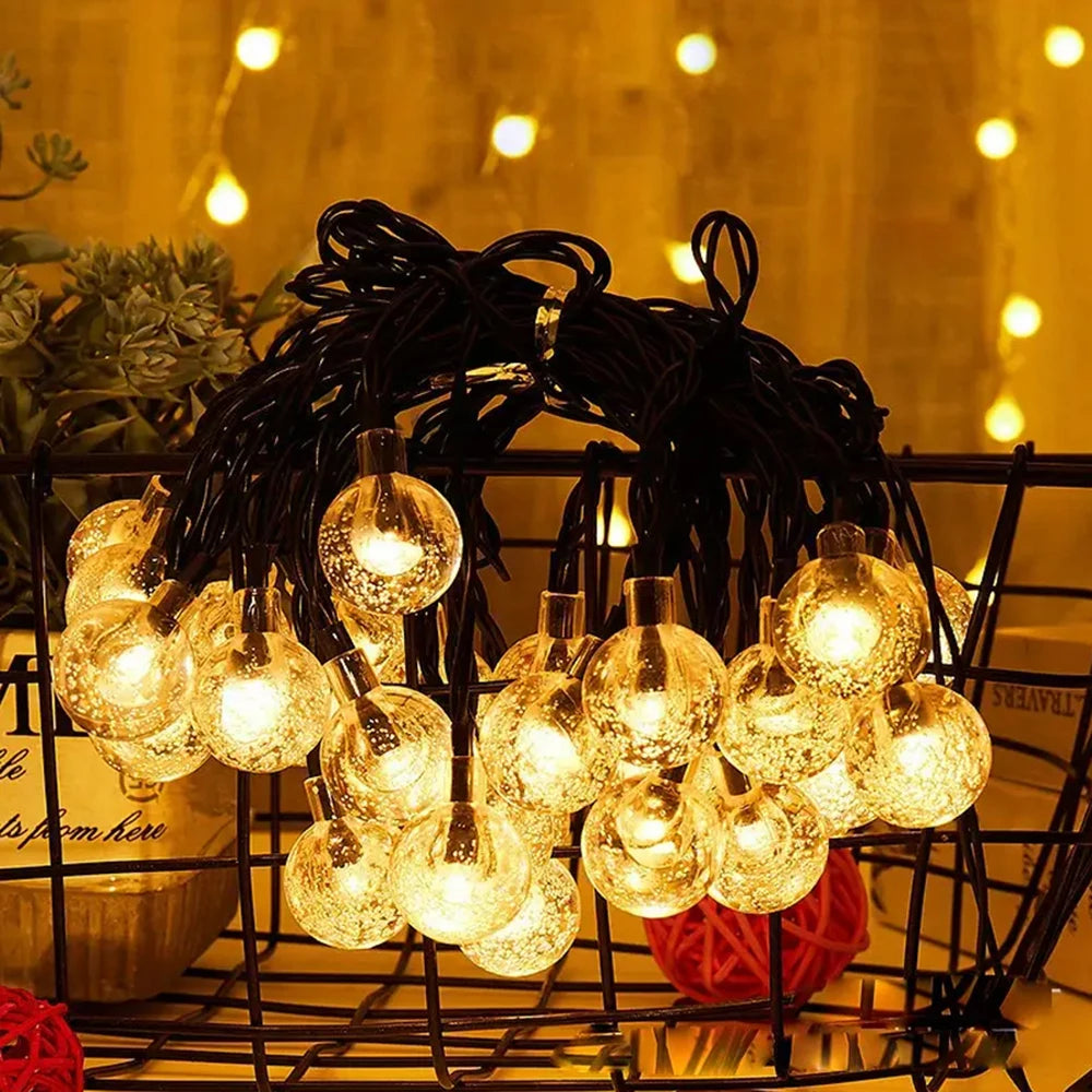 Illuminate your outdoor spaces with the enchanting glow of WELPUR Solar Bubble Ball String Lights.