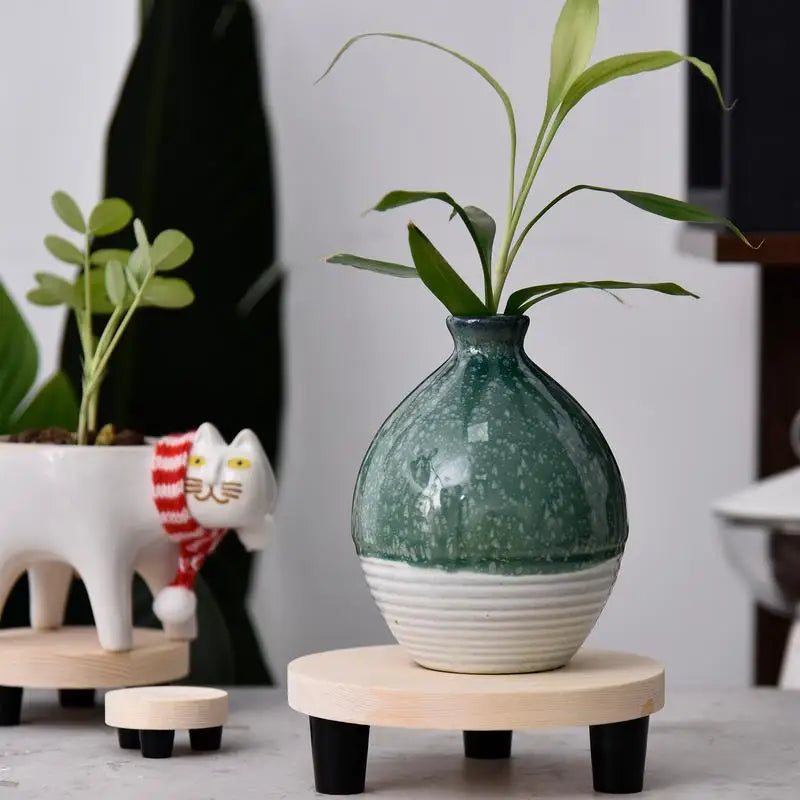 Brand None presents a durable wooden planter stand that organizes your space with style.